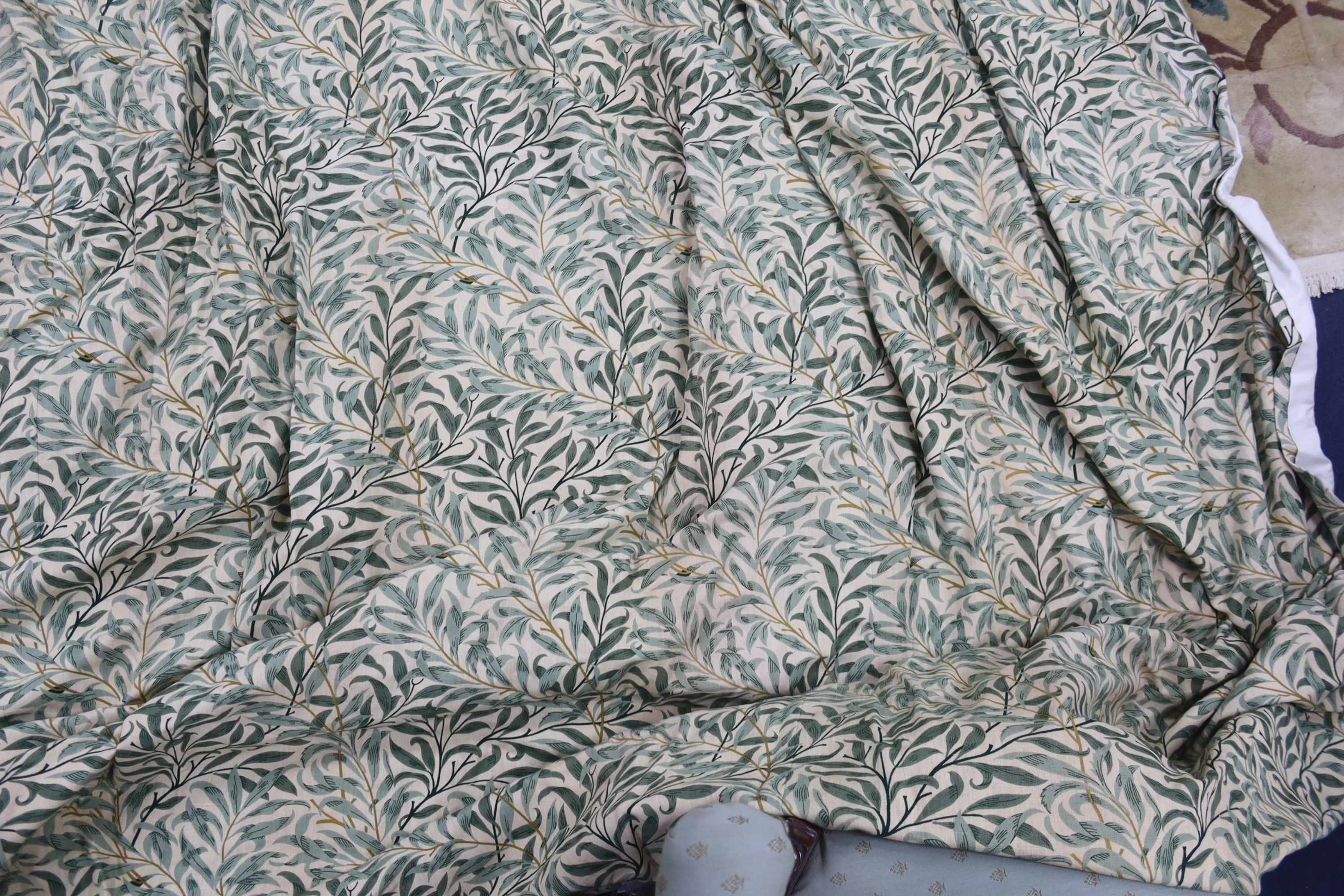 A pair of linen, 'Morris' style curtains and another pair of cotton curtains with a pineapple design